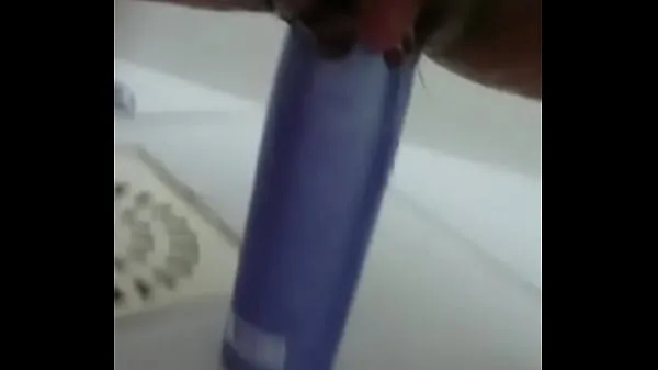 Watch Stuffing the shampoo into the pussy and the growing clitoris total Videos