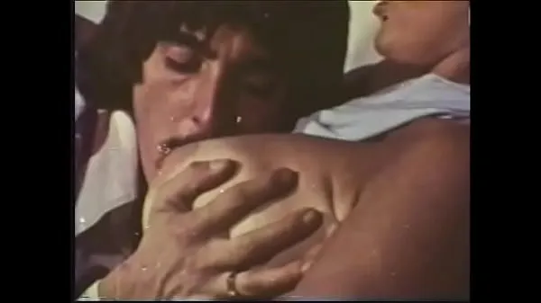 Watch A mustachioed dude with long sideburns caresses an experienced blonde with huge buckets in a 70s video total Videos